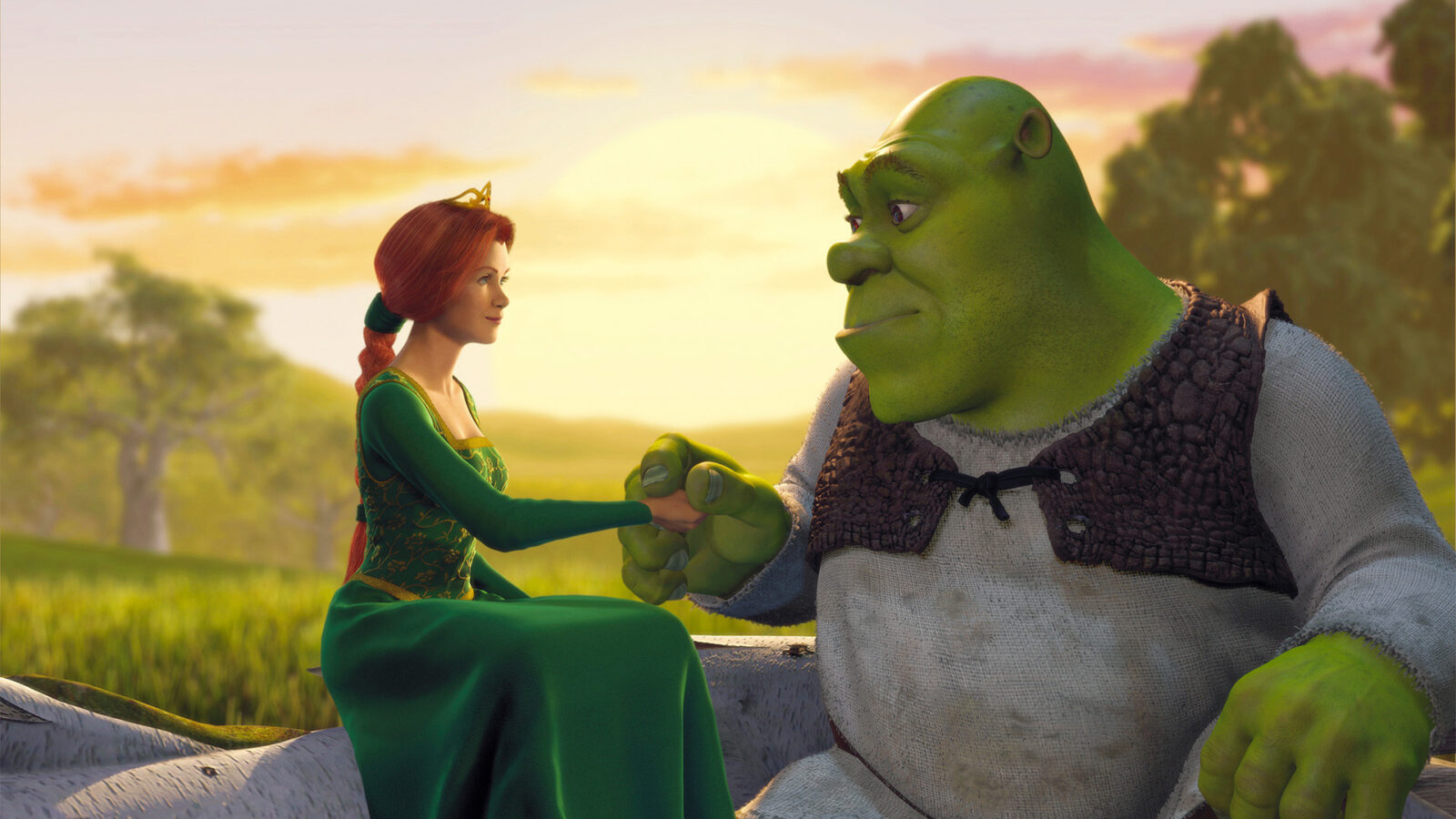 Shrek utekino Et grønt vesen i grå tunika og brun vest sitter ved siden av en rødhåret kvinne i grønn kjole med gullkrone foran et lyst landskap med trær